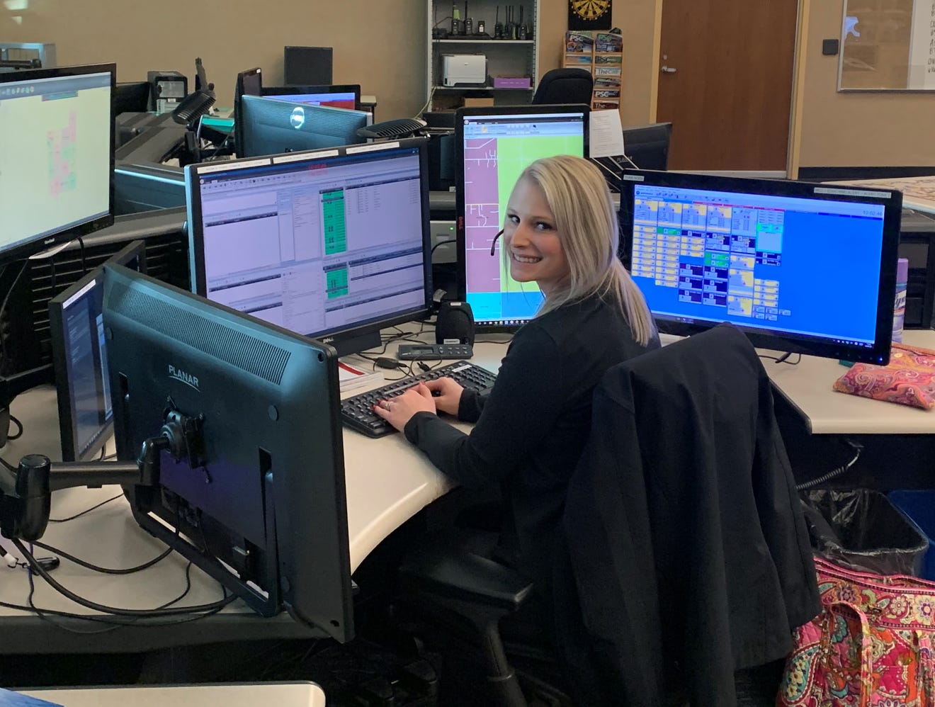 Dispatcher Katelyn Brower at her desk at Ottawa County Central Dispatch.