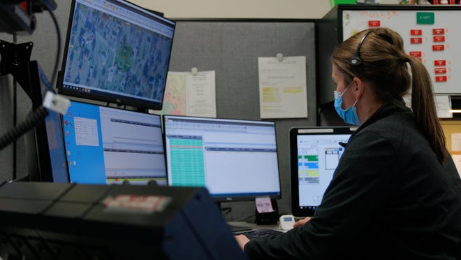 A dispatcher operates a computer at the South Summit Council of Governments dispatch center at Fire Station No. 1 in Green. The center began operations Tuesday.