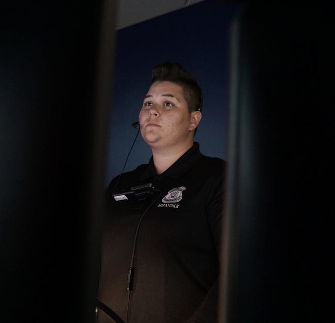                                  Farmington Hills' dispatcher Caitlyn Bailey monitors her screens inside the police department on May 19, 2021.                             