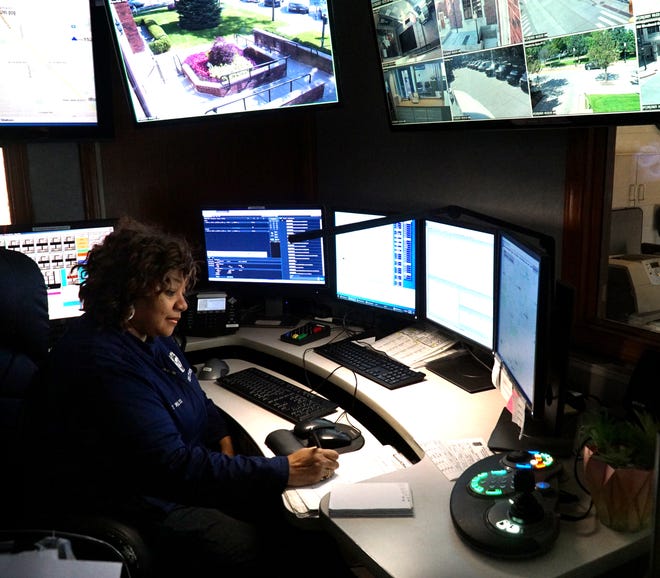 Birmingham Police Department employee Terez Willis is preparing to retire from dispatch work after 31 years on the job. Here she monitors multiple computer screens at the department's Martin Street location.