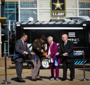 From left to right, Richard Carrizzo, vice chair, FirstNet Government Authority Board of Directors; Lt. Gen. Donnie Walker, deputy commanding general of Army Materiel Command and senior commander of Redstone Arsenal; Alabama Governor Kay Ivey; and Wayne Hutchens, president of AT&T Alabama, cut a ribbon in honor of the FirstNet partnership on the AMC Parade Field Dec. 2, 2021. (Photo by Eben Boothby, U.S. Army Materiel Command Public Affairs)