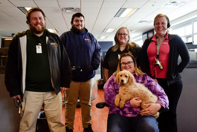 Members of the St. Clair County Central Dispatch staff at the St. Clair County Sheriff's Office in Port Huron Township on Wednesday, March 30, 2022. From left to right: Dan Favre, Dean Peacock, Jeanette Thompson, Taylor Elsholz, and Kaylee Gerrow.