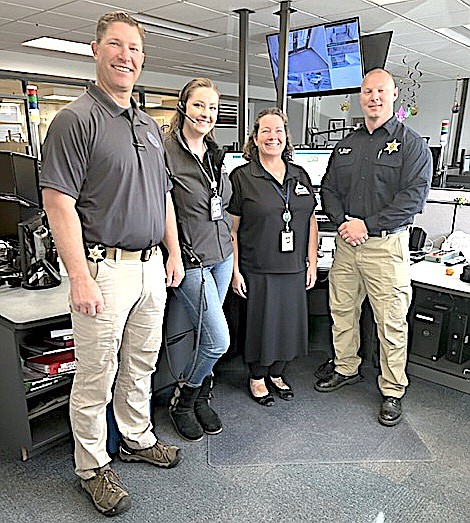 Douglas County Sheriff Dan Coverley with Emergency Communication Specialists Kaitlyn Hall,  Cirra Woods and Sheriff's Capt. Rick Koontz. Douglas County Photo